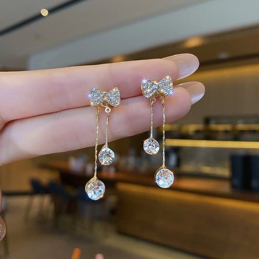 Korean Crystal Bow Drop Earrings - hand held