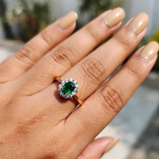 Emerald Green Oval Crystal Halo Adjustable Ring worn on finger outdoors