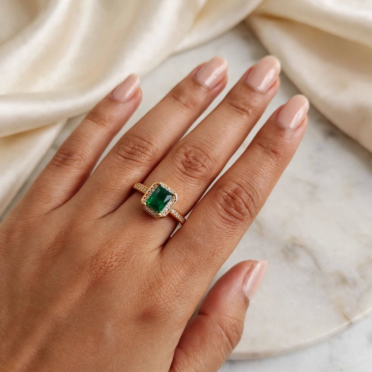 Emerald Green Emerald-Cut Crystal Halo Adjustable Ring in Rose Gold worn on hand close-up